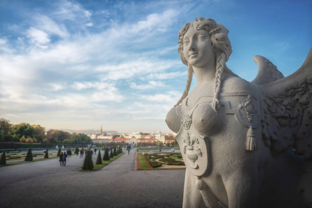 Vienna, Austria - May 28, 2015: Unidentified tourists by sightseeing of famous Upper Belvedere Palace. The Belvedere is a historic building complex in Vienna, Austria, consisting of two Baroque palaces the Upper (1717-1723), Lower Belvedere (1714-1716) and Gardens by Dominique Girard. Belvedere is one of the first public museums (1781) in the world