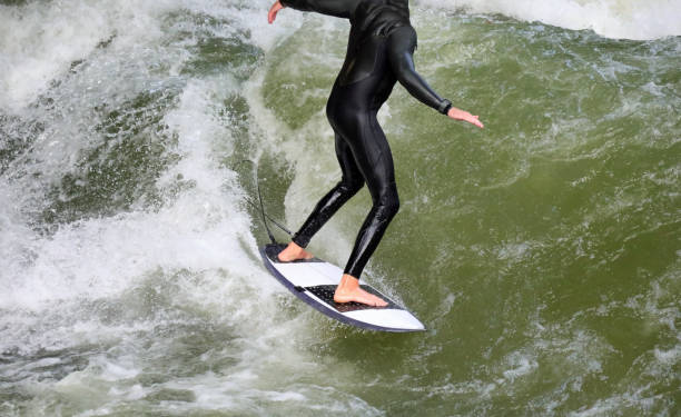 istock man without shoe on the surfboard 1391814332