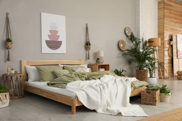 istock Stylish room interior with comfortable wooden bed 1391814422