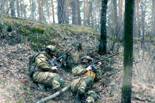 istock Two mercenaries in an ambush during a special operation in the forest 1391820040