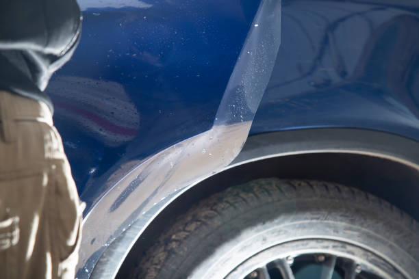 istock Installing a protective film on the car. 1391820167