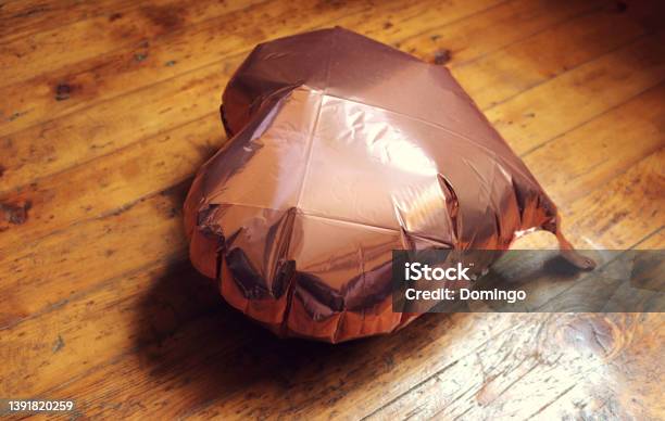 Inflatable Balloon In The Shape Of A Pink Heart Lying On The Ground Half Deflated As A Symbol Of Lost Love Or Heartbreak Stock Photo - Download Image Now