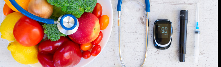 raw vegetables and fruits with blood glucose meter and insulin syringe, diabetes healthy diet concept