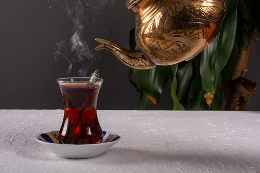 a glass of hot turkish tea on the table