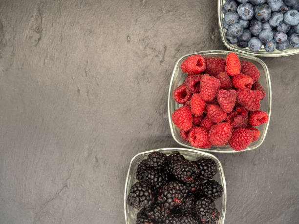istock top view of bowls with forest berries on black slate 1391822114