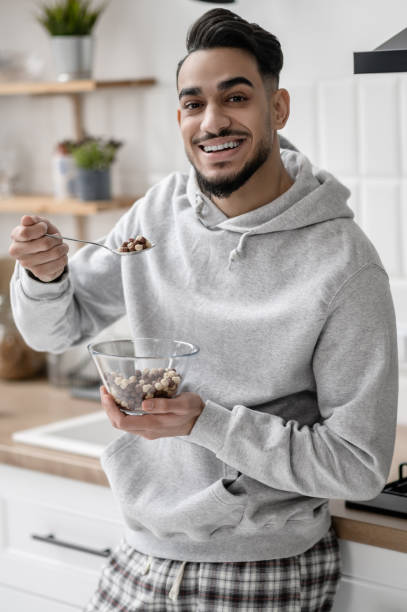 istock A young man spending morning at home and having coffee 1391823393