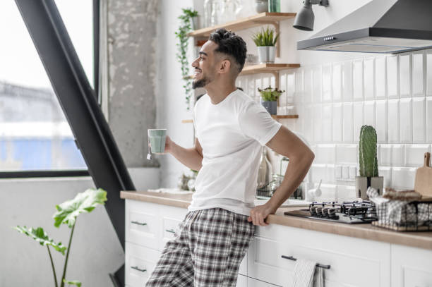istock A young man spending morning at home and having coffee 1391823399