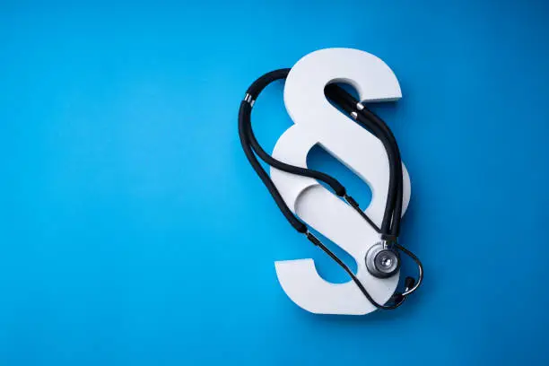 Stethoscope And Paragraph Symbol On Blue Background