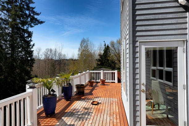istock Home outdoor cedar wood deck boards being stained with materials on the deck 1391827635