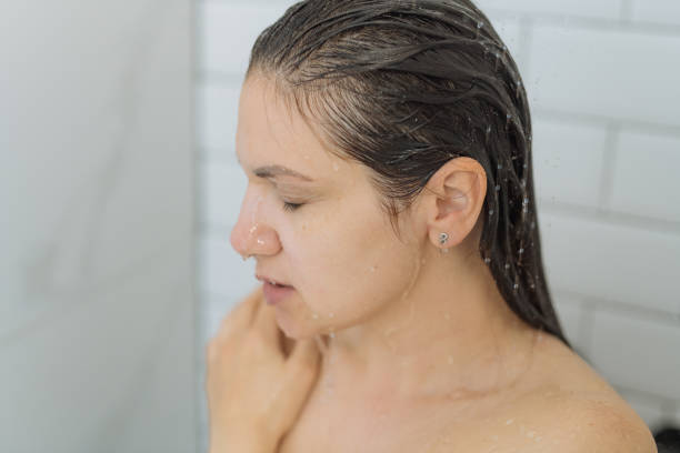 istock Woman enjoying shower 1391828397