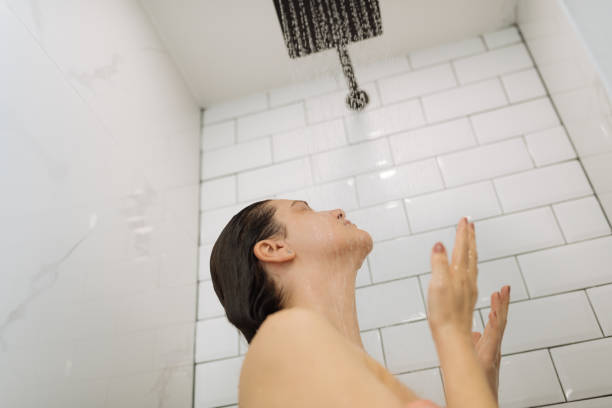 istock Woman enjoying shower 1391828437