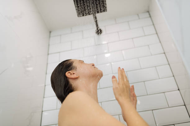 istock Woman enjoying shower 1391828464
