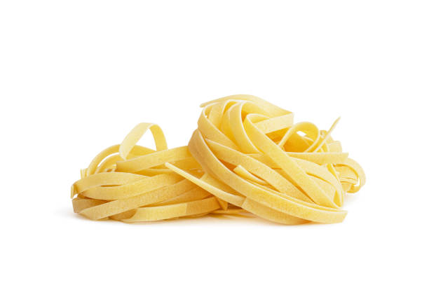 istock raw tagliatelle pasta with egg yolk in shell on white background 1391829352