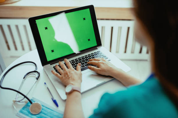 istock Nurse or doctor using modern laptop device for electronic banking 1391829480