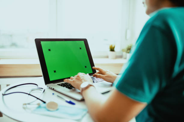 istock Nurse or doctor using modern laptop device for electronic banking 1391829483