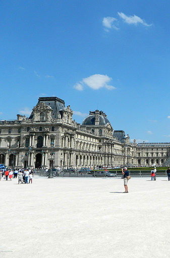 Paris, France - June 3, 2013: People at museum garden in Rue de Rivoli, 75001 Paris, Fransa in a sunny day in paris.