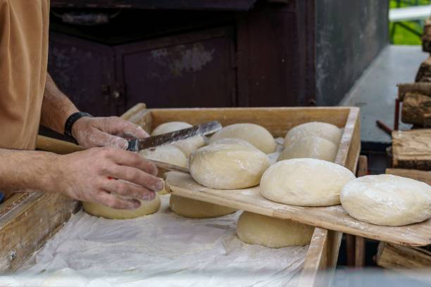 istock Man preparing the dough to make bread in an artisan and natural way. 1391831057