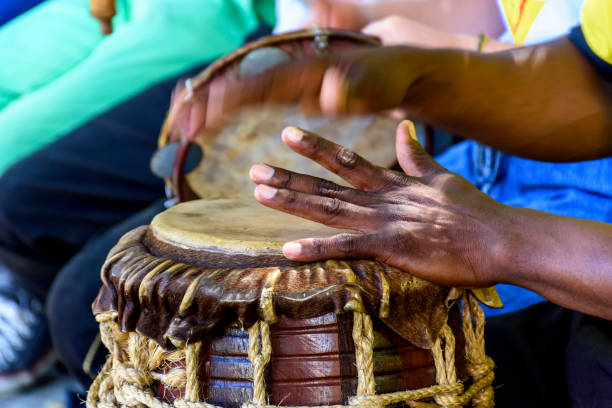 istock Musician playing a rudimentary percursion instrument called atabaque 1391832133