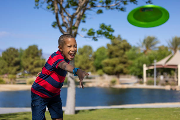 A man tossing a Frisbee.
