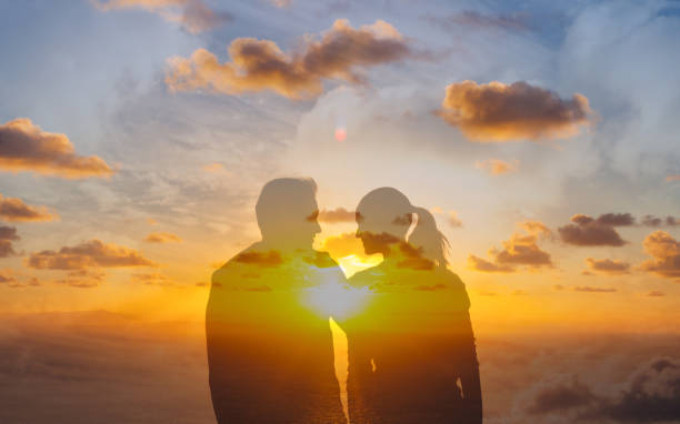 istock Romantic couple at sunset. Love, relationship concept. 1391844443