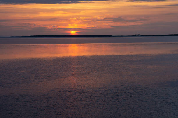 istock Beautiful lake dusk reflecting the setting sun 1391845097