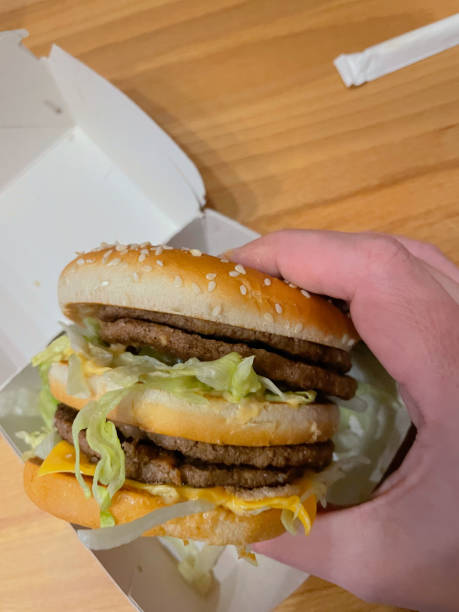 istock Double juicy beef burger in my hand. 1391845272