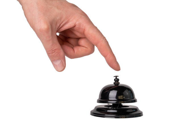istock Man hand pressing call bell button isolated on white background. Ring for assistance in hotel, store, cafe, restaurant 1391849152