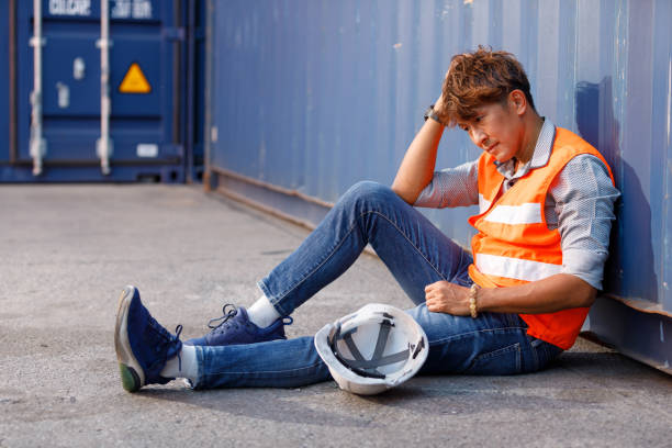 istock factory worker or engineer feeling tired and disappointed from work in containers warehouse storage 1391851225