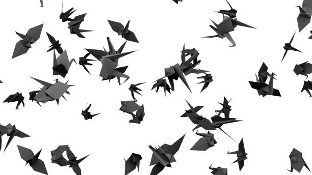 istock Black origami crane on white background. 1391851240