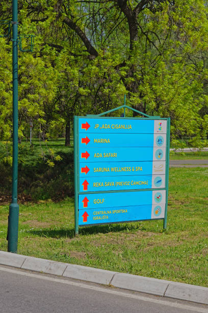 Belgrade, Serbia - April 13, 2018: Sign board with directions at entry to Ada Ciganlija recreation park lake.