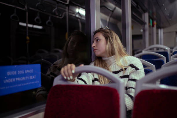 istock A tired woman returns from work riding a bus. 1391854341