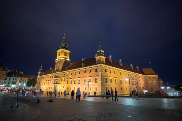 Warsaw, Poland - August 21, 2019: Exterior view of the buildings in Warsaw old town square at night.