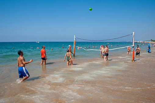 Antalya, Turkey - August 30, 2018 : Tourists playing beach volleyball in the sea
