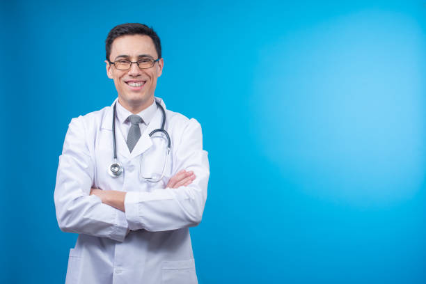 istock Smiling physician with crossed arms 1391863145