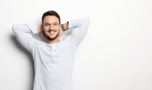 istock happy smiling man looking at camera on white background 1391864775