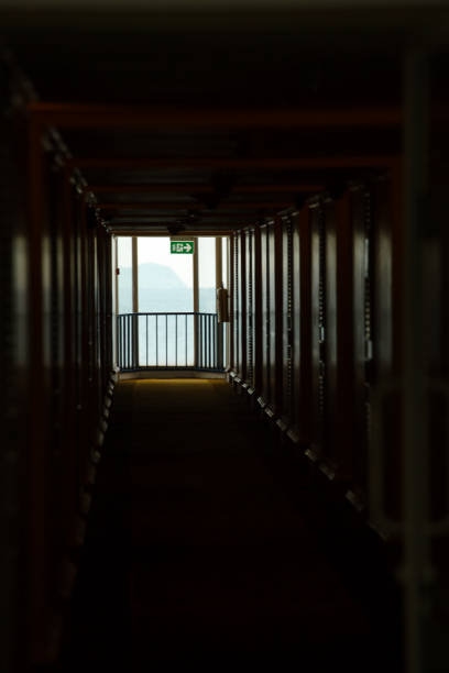 istock Exit doors to light from corridors in dark buildings, rooms, hotels, hospitals. 1391869118