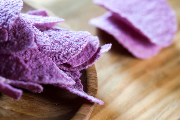 istock potato chips on wooden table 1391870012