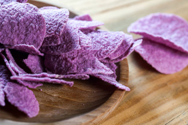 potato chips on wooden table stock photo