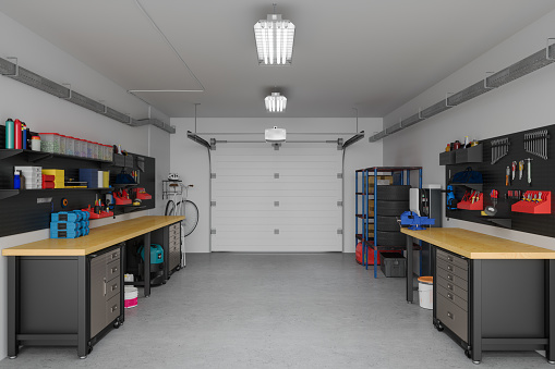 Moderno interior de garaje vacío con equipos de trabajo y herramientas photo