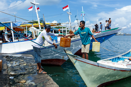 Jerry cans for storing fuel supplies for fishing boats at Paotere harbor, Makassar, Indonesia on April 04, 2022