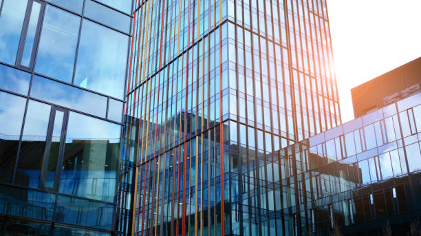 istock Modern office building with glass facade on a clear sky background. 1391881574