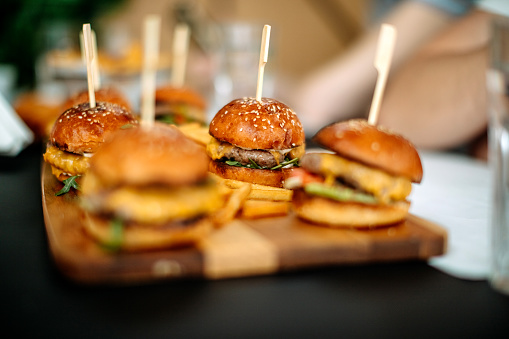 Tasty burgers served on table