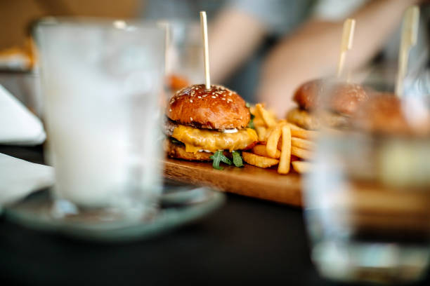 Tasty burgers served on table