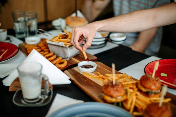 istock Friends dining together in restaurant 1391881652