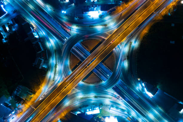 Aerial view of car traffic transportation above circle roundabout road in Asian city. stock photo