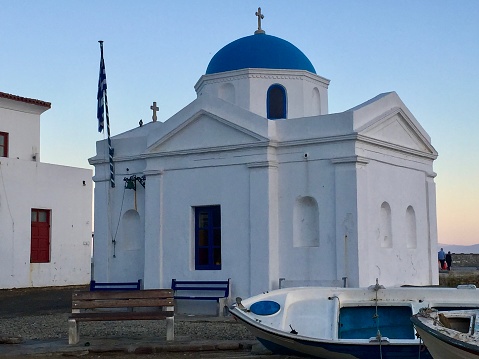 Blue dome and white cross on a greek Orthodox Church.