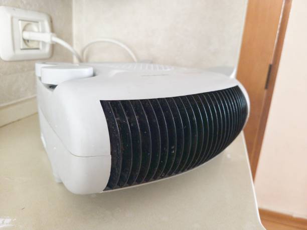 istock White Electric Standing Fan Heater, Energy Saving 1391886564
