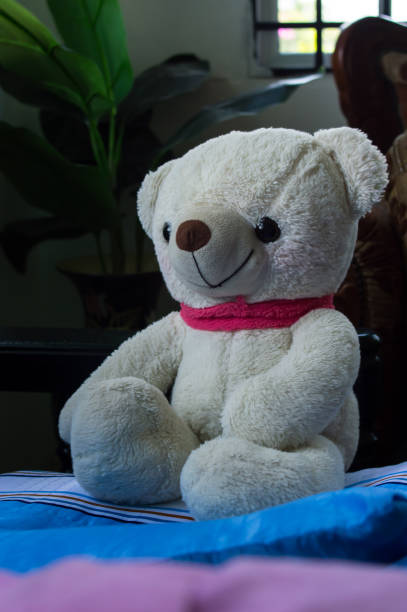 istock a fluffy teddy bear that was sitting on a chair 1391886571
