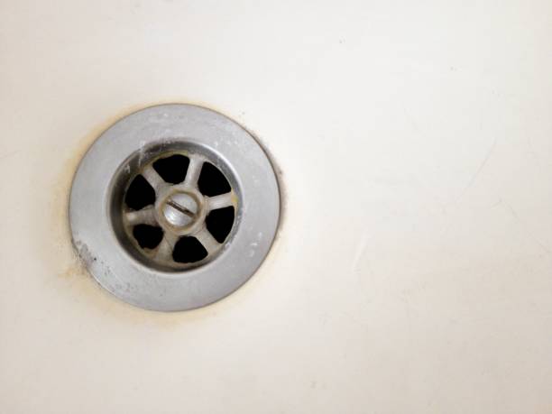 istock Round Grey Metal Drain in a Sink 1391886577