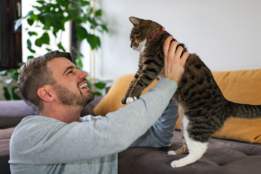 Man and his best friend, a cat.